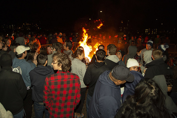 students around homecoming bonfire